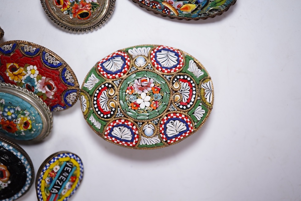 Thirty-one costume micro-mosaic brooches, to include seventeen guitar and banjo shaped brooches, five large oval/ circular brooches including scenic swan brooch, eight, smaller brooches and a pendant. Condition - fair/go
